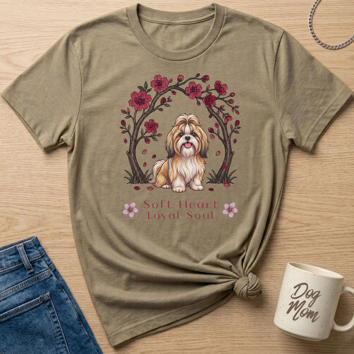 Shih Tzu dog sitting under cherry blossoms with text "Soft Heart Loyal Soul"