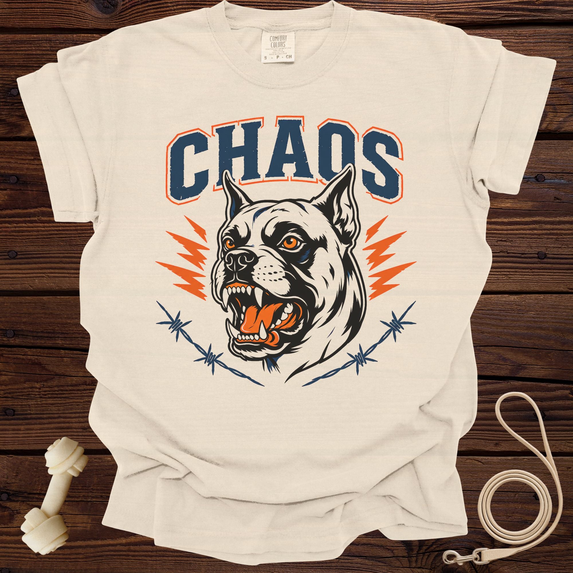 Light beige t-shirt with "CHAOS" text and a snarling dog graphic with barbed wire.
