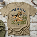 German Shepherd with stick on t-shirt reading "Trailhead Zoomies" with mountains and trees.