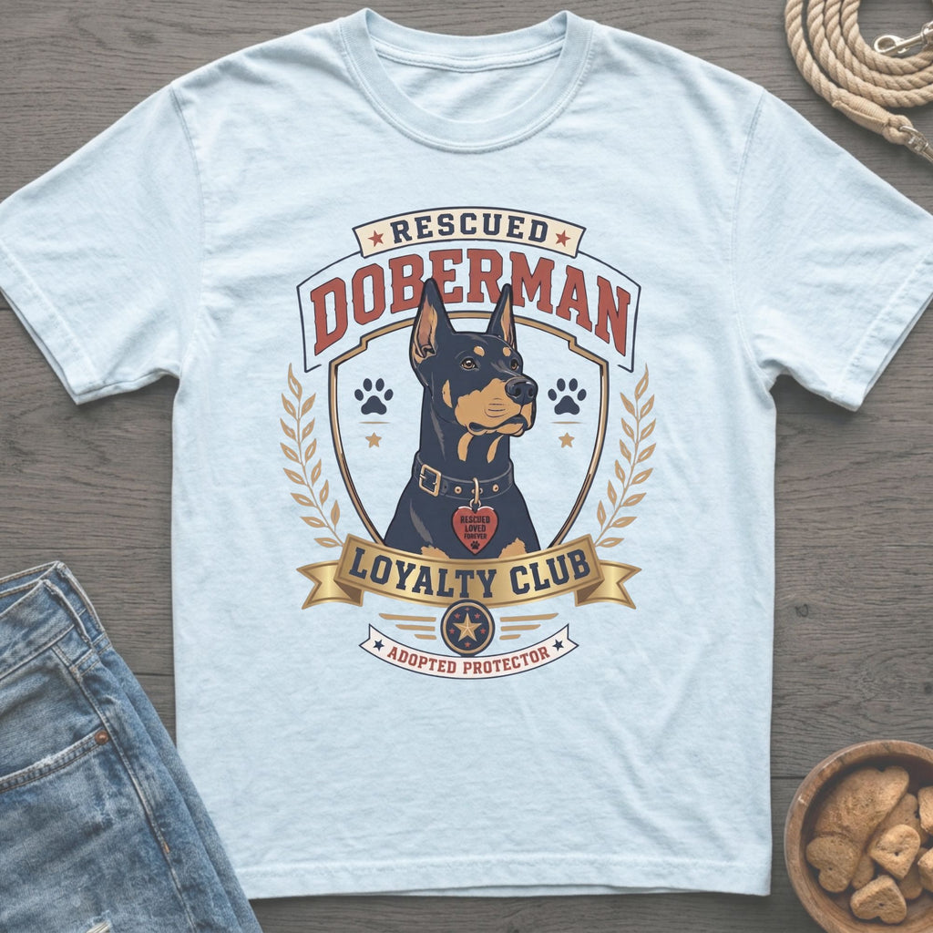 Light blue t-shirt with rescued Doberman loyalty club graphic.