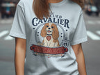 "Rescued Cavalier" t-shirt design featuring a dog with text and hearts.
