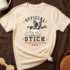 French bulldog carrying stick with text "Official Stick Transportation Dept".