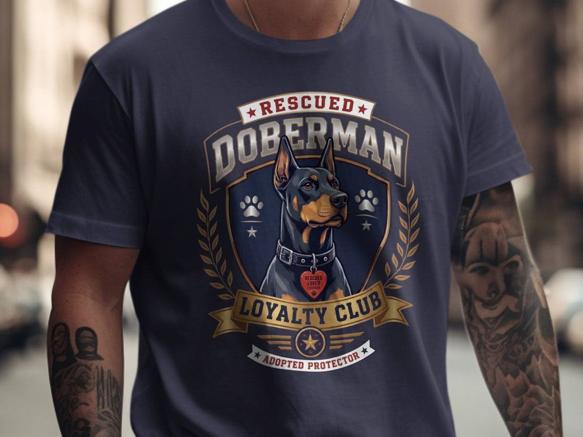 Navy t-shirt with a Doberman design featuring "Rescued Doberman Loyalty Club Adopted Protector".
