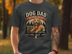 Dog Dad Department t-shirt with dog, treats, leash, and paw print.