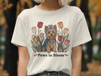 Yorkshire Terrier dog with tulips and text "Paws in Bloom" on a t-shirt.