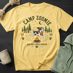 Yellow t-shirt with "CAMP ZOOMIE" graphic, dog, campfire, and trees.