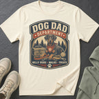Cream t-shirt with "Dog Dad Department" design featuring a dog, leashes, and toolbox.