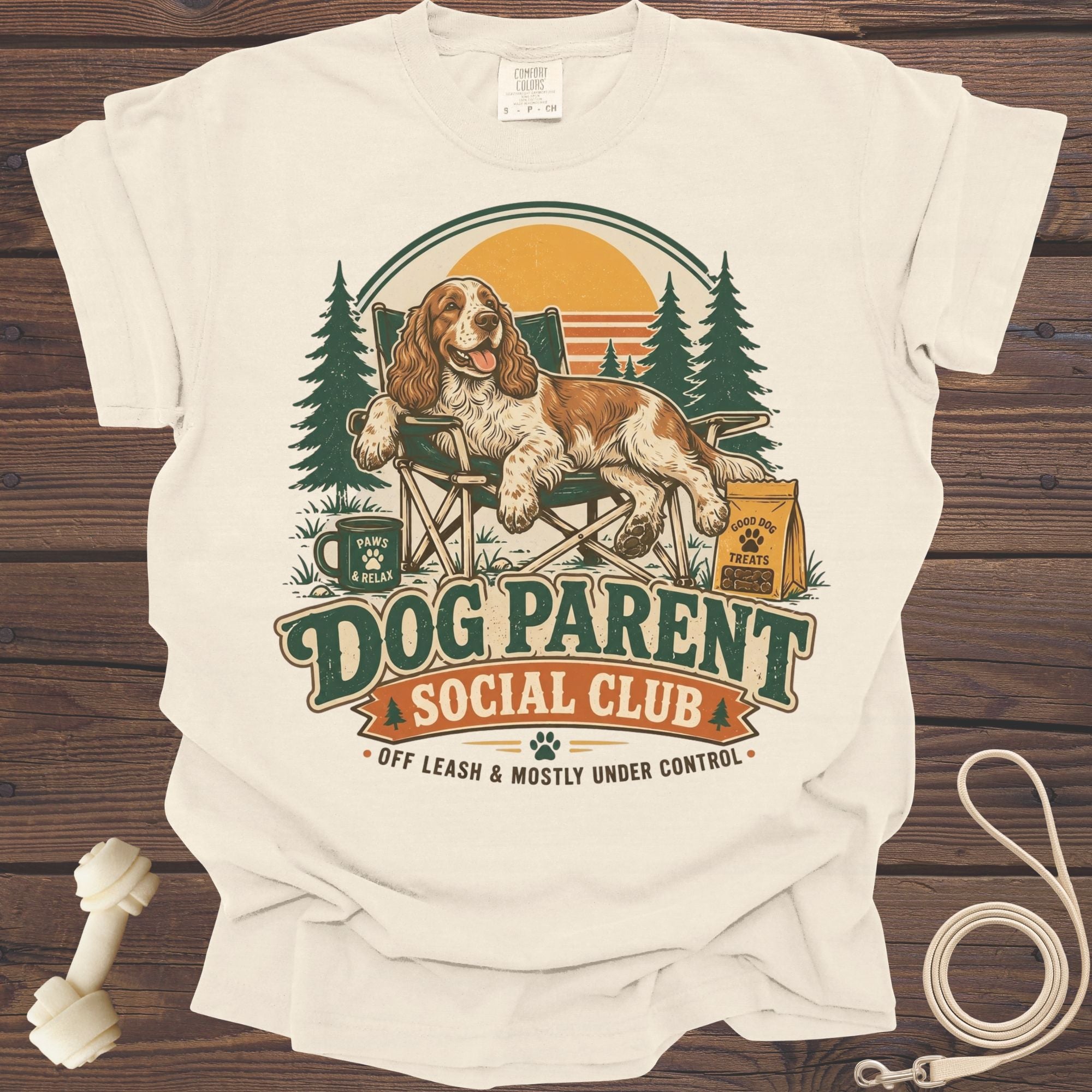 A dog relaxes in a chair with text "Dog Parent Social Club" and trees.