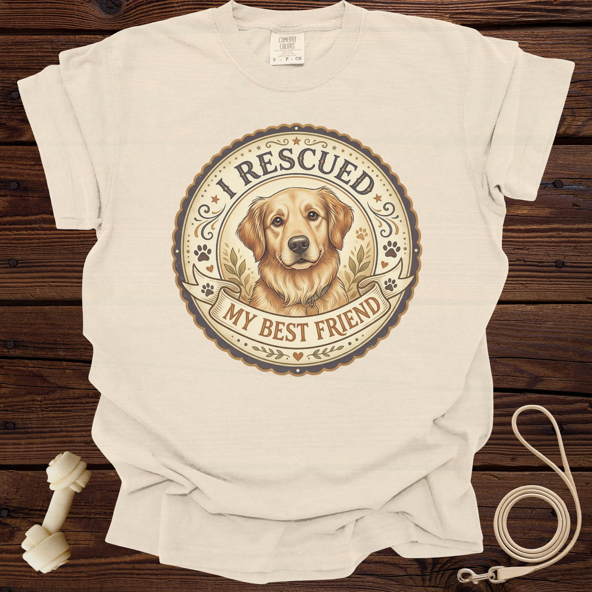 Cream t-shirt with "I rescued my best friend" and golden retriever graphic.