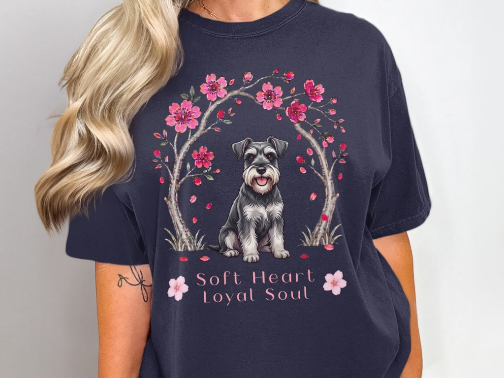 Schnauzer dog under cherry blossoms with text "Soft Heart Loyal Soul".