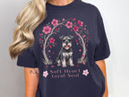 Schnauzer dog under cherry blossoms with text "Soft Heart Loyal Soul".