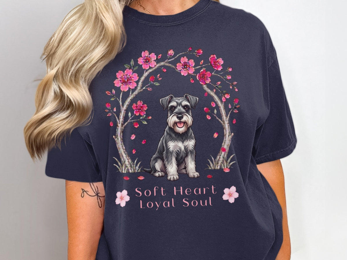 Schnauzer dog under cherry blossoms with text "Soft Heart Loyal Soul".
