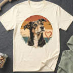 Cream t-shirt with a dog portrait, distressed sunset, and heart graphic.