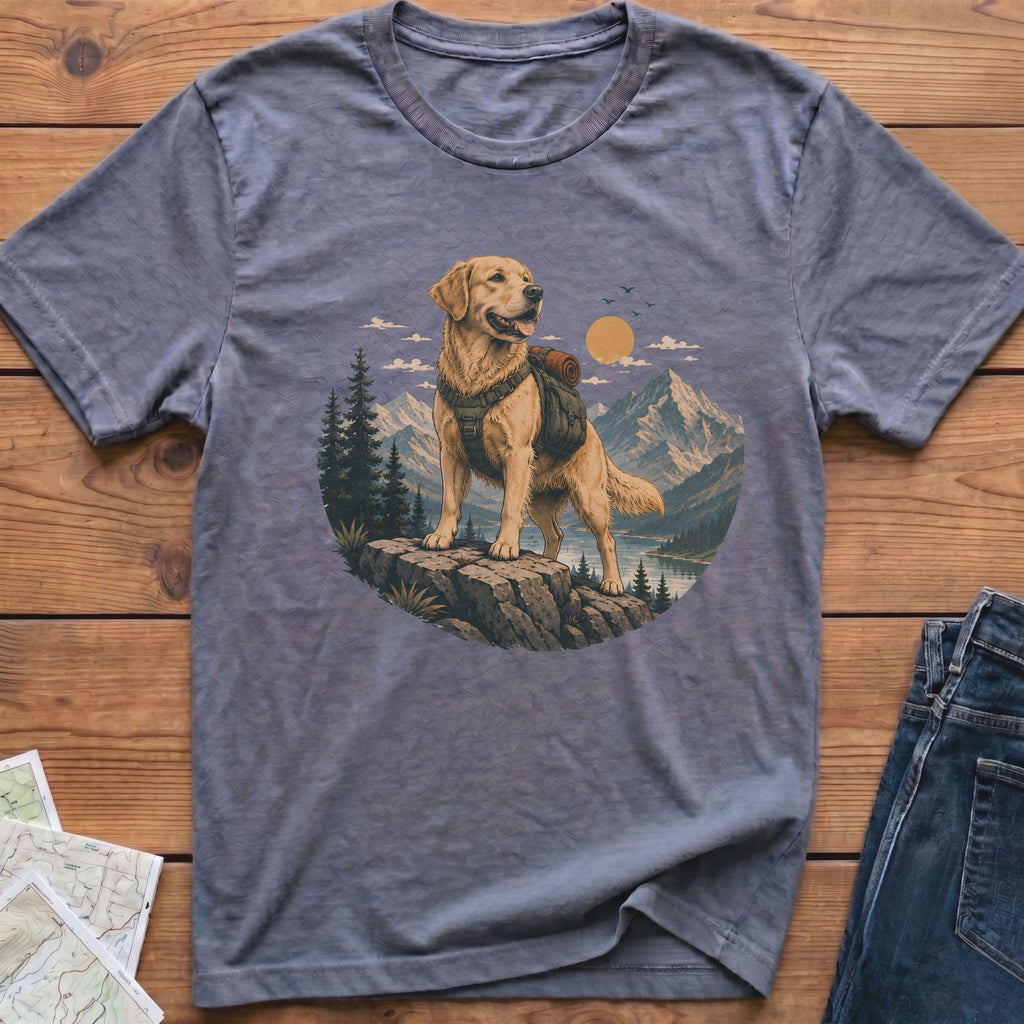 Golden retriever dog with backpack stands on rock in mountain landscape.