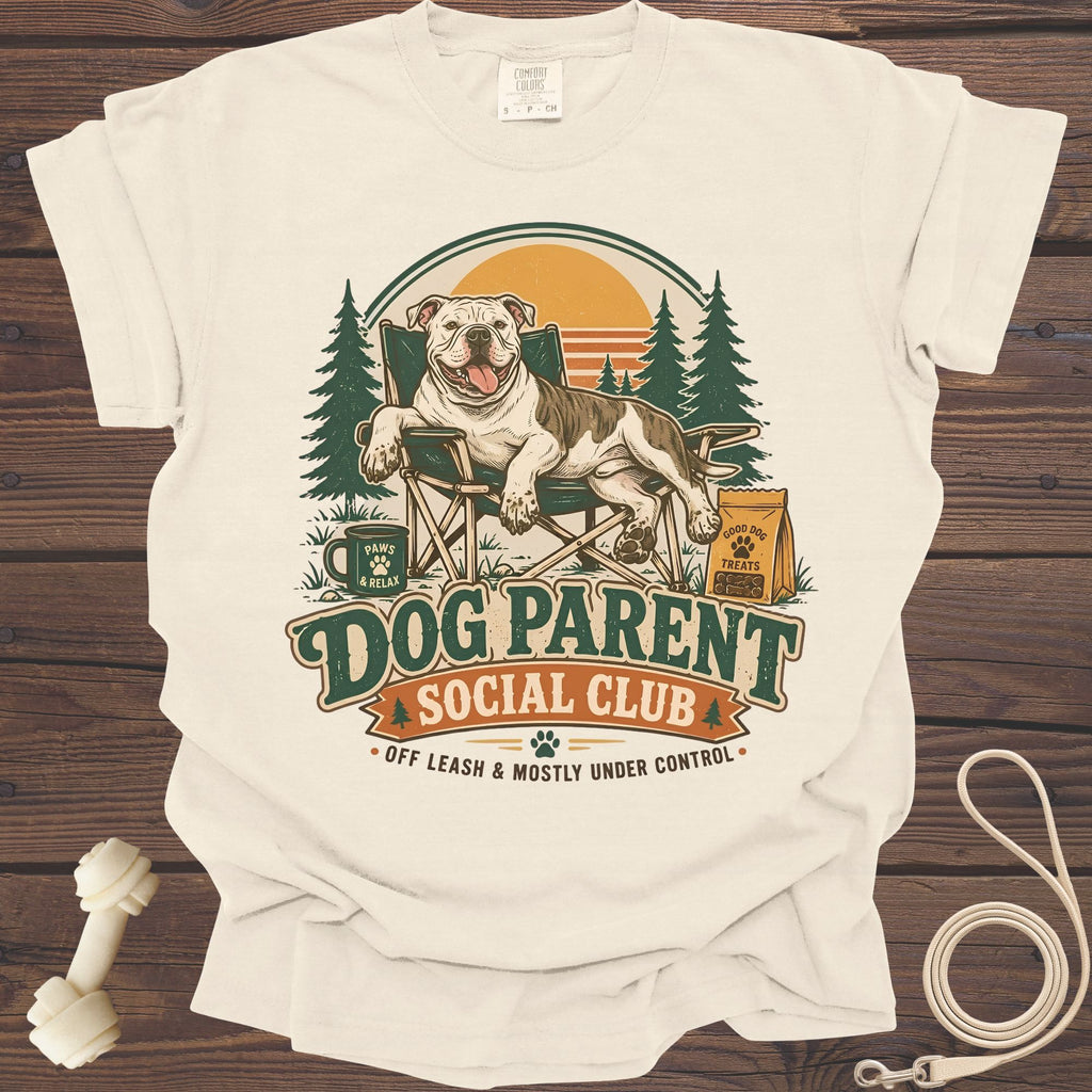 Cream t-shirt with dog sitting in a camping chair with "Dog Parent Social Club" text.