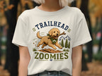 T-shirt graphic with a dog running with a stick, text reads "TRAILHEAD ZOOMIES".