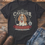 Dark grey t-shirt with a Cavalier King Charles Spaniel graphic and text.