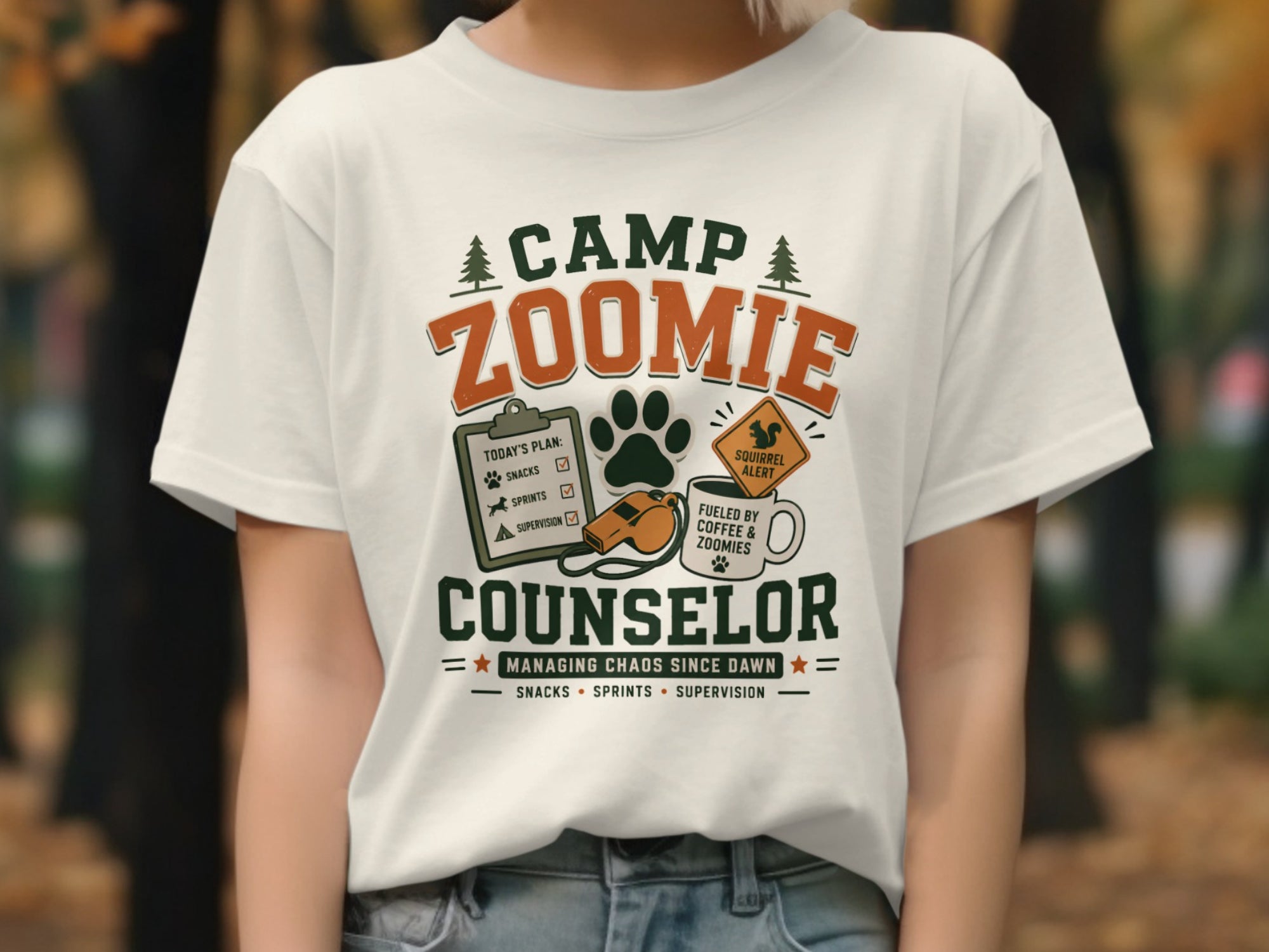 Camp Zoomie Counselor shirt with a clipboard, paw print, whistle, and coffee mug.