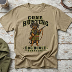 T-shirt with dachshund in hunting gear holding a rifle, text "Gone Hunting Dog House Hunt Club".