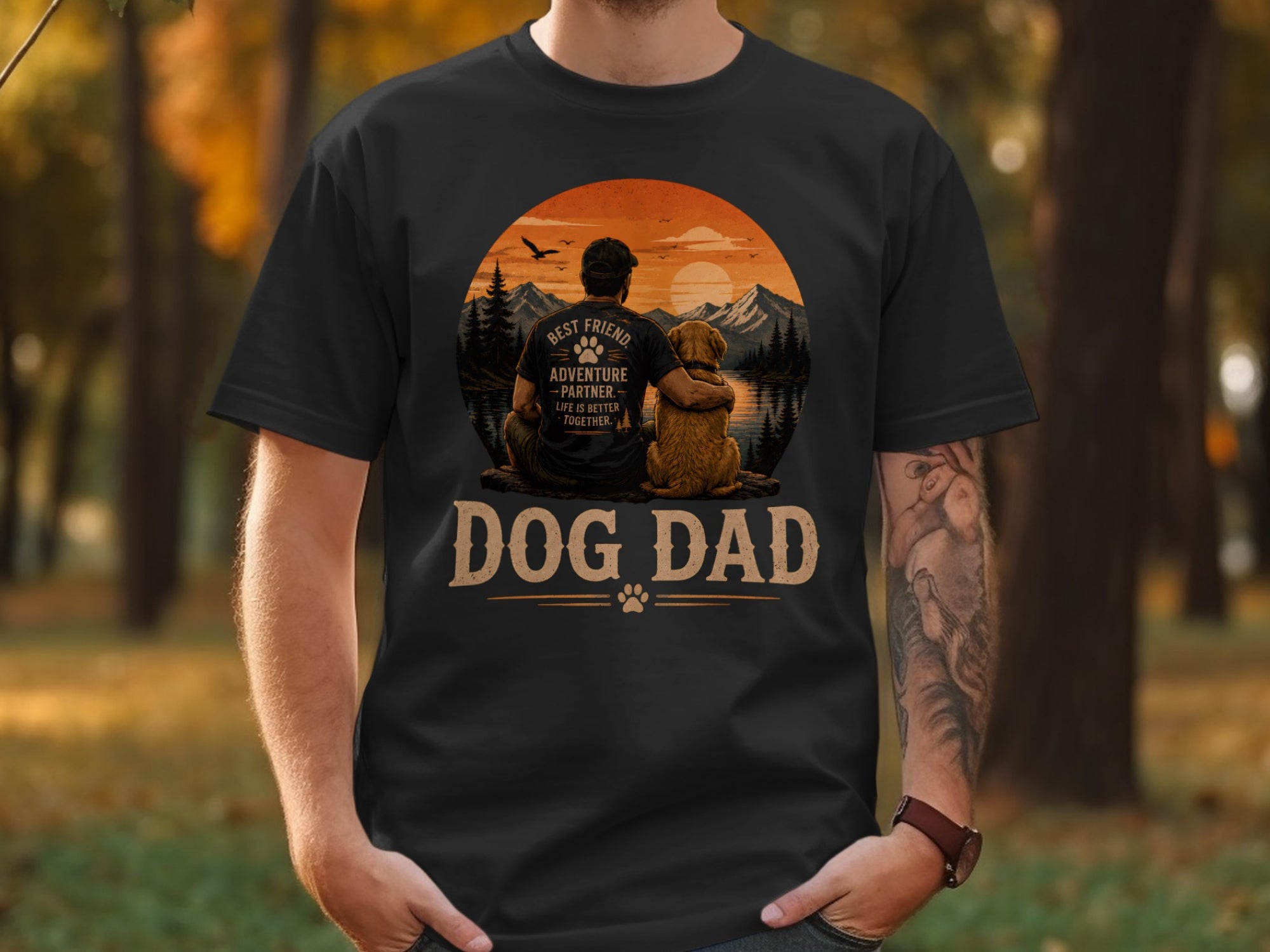 Black t-shirt with "Dog Dad" text and a man with a dog at sunset.
