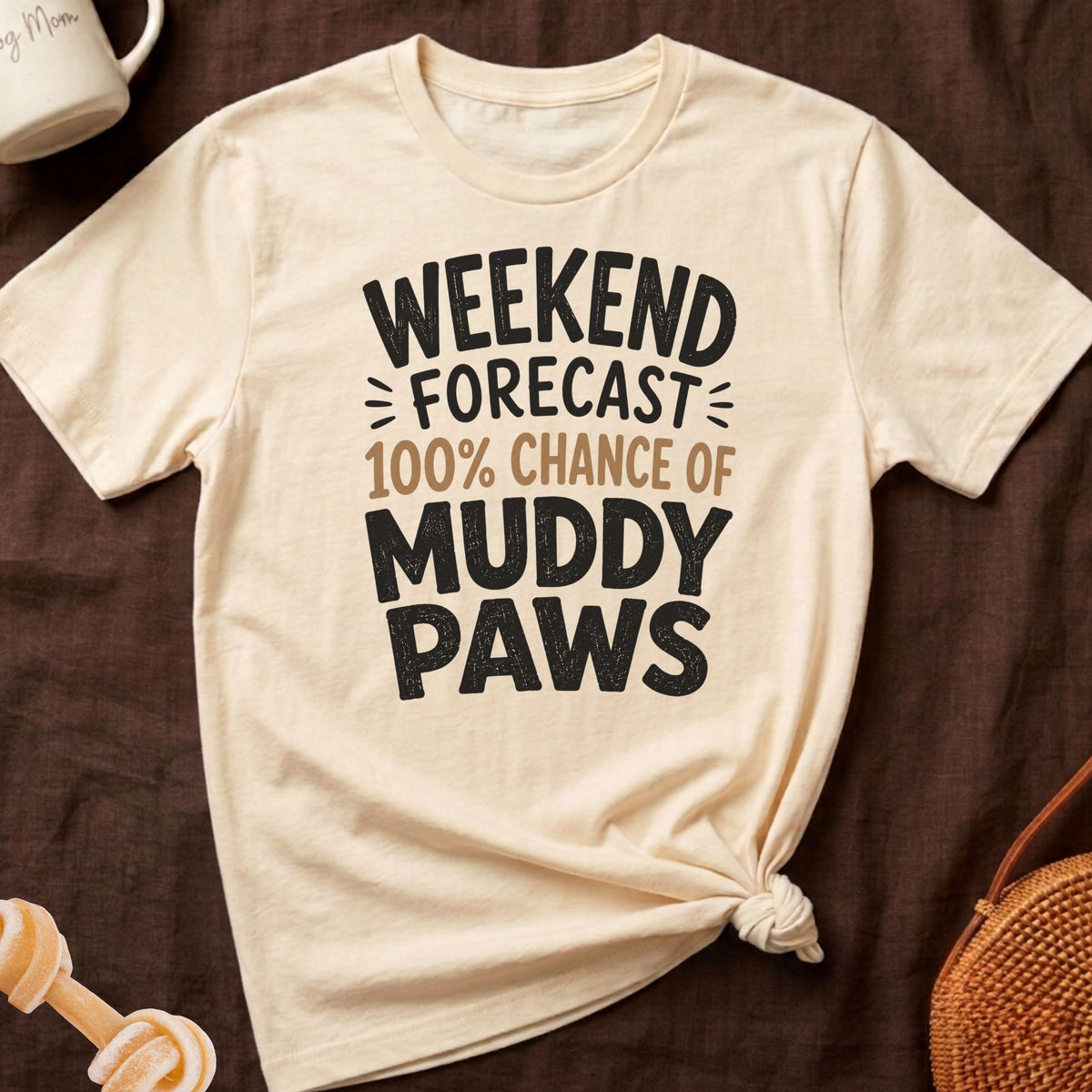 Cream t-shirt with "Weekend Forecast 100% Chance of Muddy Paws" text.