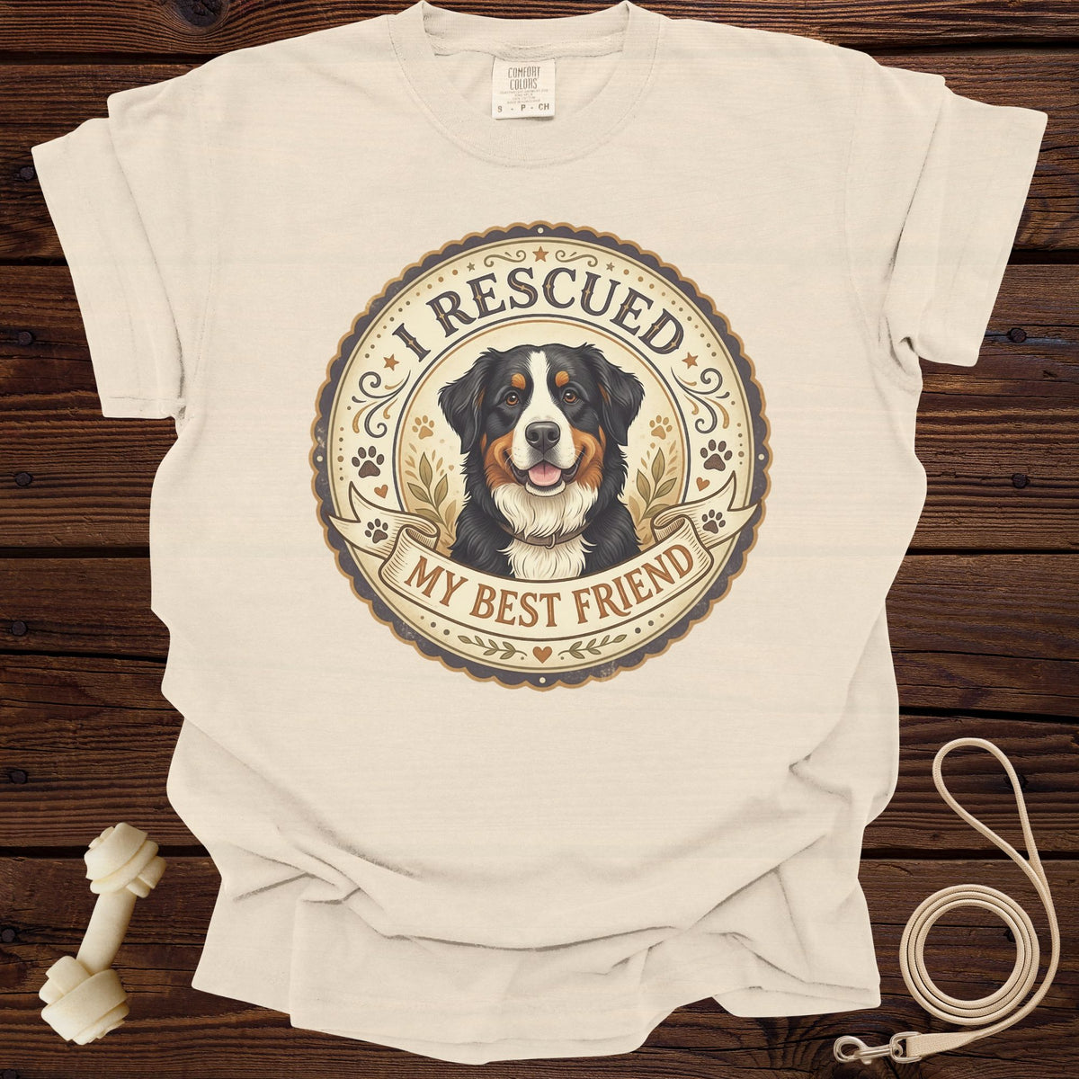 Cream t-shirt with Bernese Mountain Dog graphic reading "I RESCUED MY BEST FRIEND".