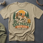 Tan t-shirt with dog relaxing in a chair, "Dog Parent Social Club" text.