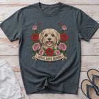Fluffy dog surrounded by roses with "Loyal Love Blooms" text on banner.