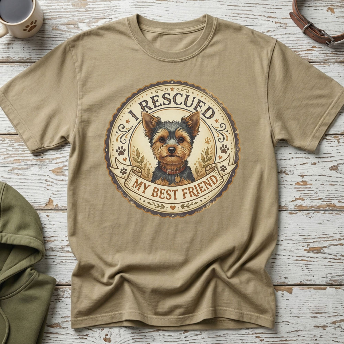 Tan t-shirt with a circular graphic of a Yorkshire terrier, reading "I Rescued My Best Friend."