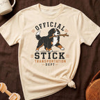 Cream t-shirt with a Bernese Mountain Dog graphic and text "OFFICIAL STICK TRANSPORTATION DEPT."