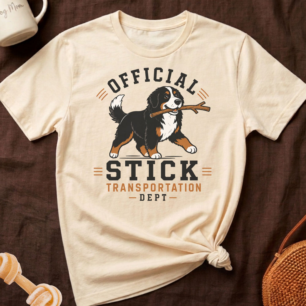 Cream t-shirt with a Bernese Mountain Dog graphic and text "OFFICIAL STICK TRANSPORTATION DEPT."