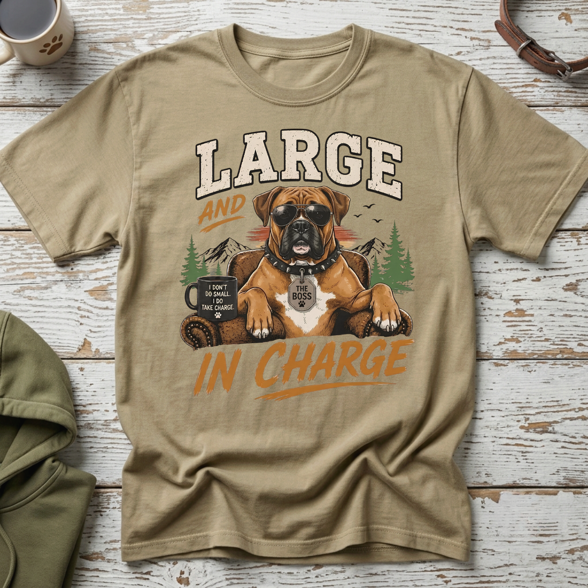 Boxer dog wearing sunglasses and a tag that says "The Boss" on a t-shirt.