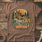 German Shepherd relaxing in a chair with "Dog Parent Social Club" text.