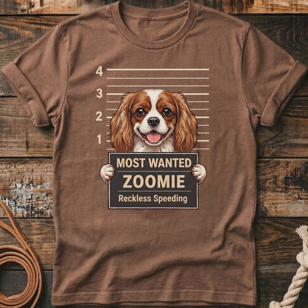 Brown t-shirt with a Cavalier King Charles Spaniel in a mugshot, reading "Most Wanted Zoomie".