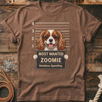 Brown t-shirt with a Cavalier King Charles Spaniel in a mugshot, reading "Most Wanted Zoomie".