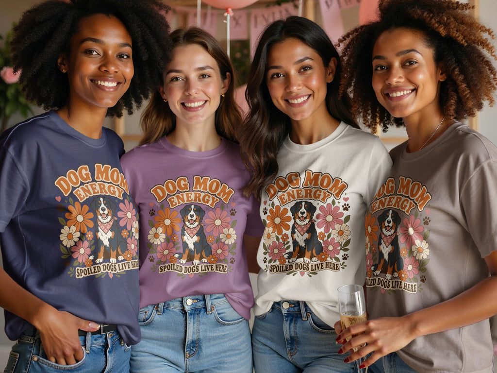 Four women wear t-shirts with a "Dog Mom Energy" design and a Bernese Mountain Dog.