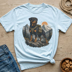 Light blue t-shirt with Rottweiler on mountain landscape graphic.