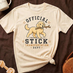 Cream t-shirt with cartoon dog carrying stick and text "Official Stick Transportation Dept".