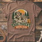 T-shirt graphic of a schnauzer relaxing in a chair with "Dog Parent Social Club" text.