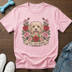 Pink t-shirt with a dog surrounded by roses and the text "Loyal Love Blooms".