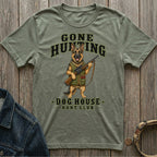 Green t-shirt with German Shepherd graphic holding rifle, text reads "GONE HUNTING DOG HOUSE HUNT CLUB".