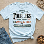 Light blue t-shirt with text "Life is better with Four Legs, Wet Noses & Wagging Tails".