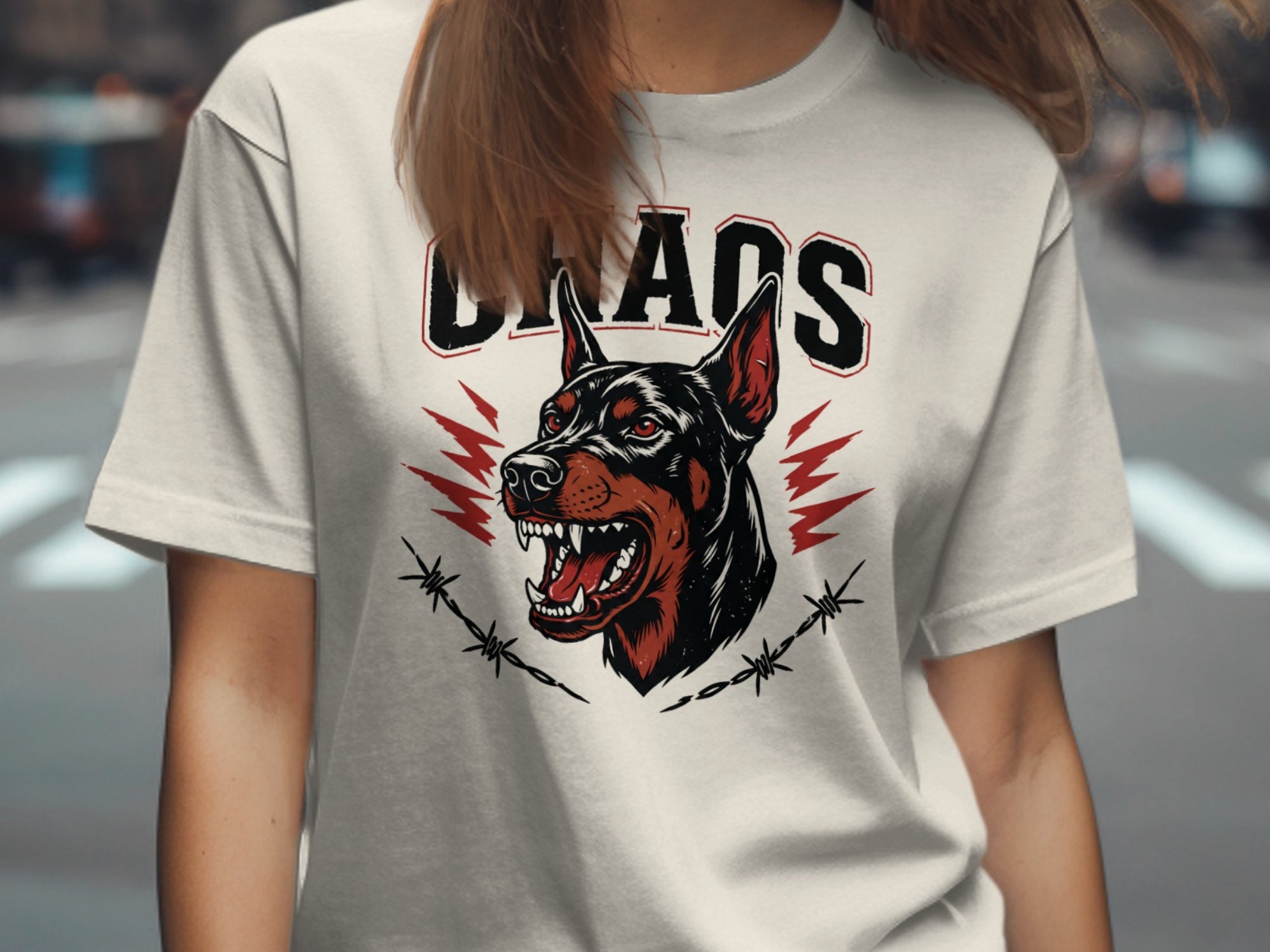 White t-shirt with "CHAOS" text over a snarling dog and barbed wire graphic.
