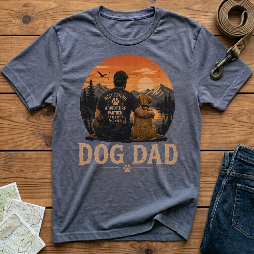 Dog Dad t-shirt with a man and dog looking at a mountain sunset.