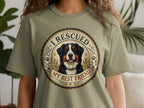 Bernese Mountain Dog graphic on light green t-shirt with text "I RESCUED MY BEST FRIEND"