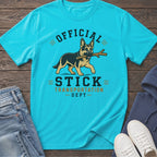 German Shepherd with stick on shirt that reads "Official Stick Transportation Dept."
