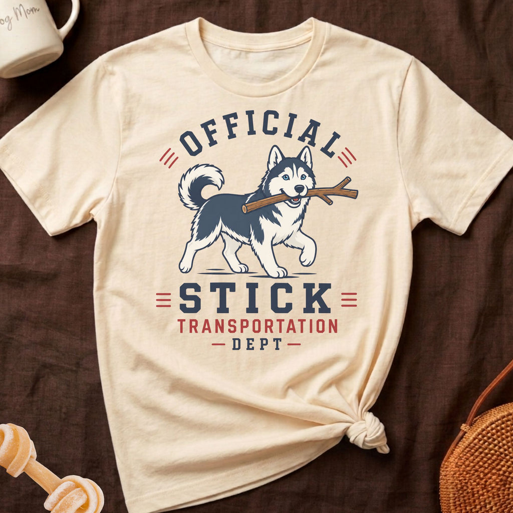 Husky with stick graphic on a cream t-shirt with text "Official Stick Transportation Dept".