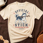 Husky with stick graphic on a cream t-shirt with text "Official Stick Transportation Dept".