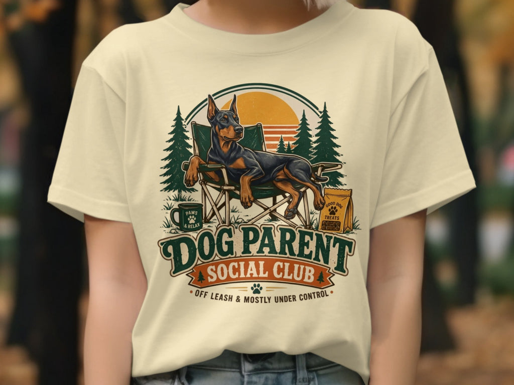 Doberman relaxing in a camping chair with "Dog Parent Social Club" text.