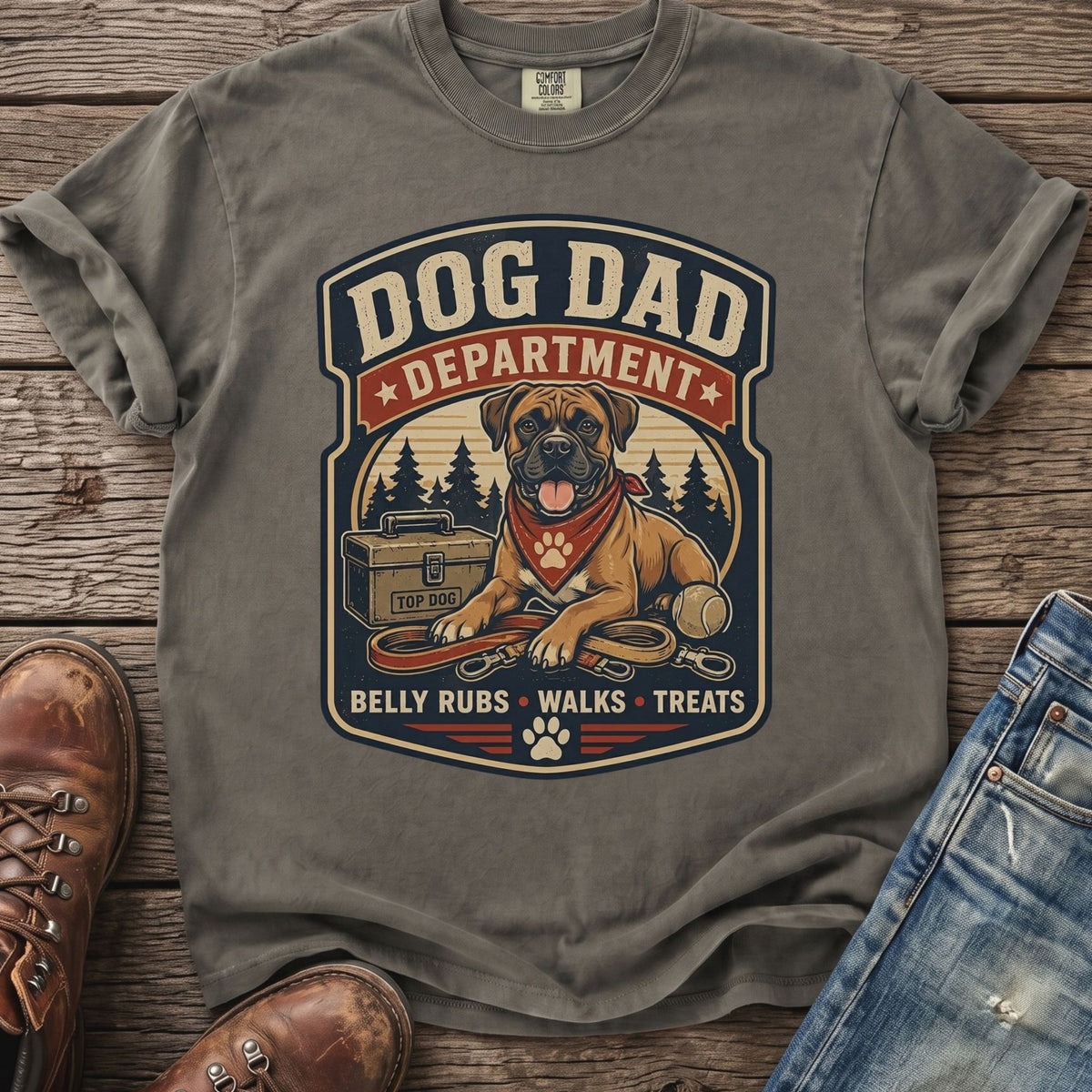 "Dog Dad Department" graphic tee with boxer dog, leash, ball, and toolbox, featuring "Belly Rubs Walks Treats".